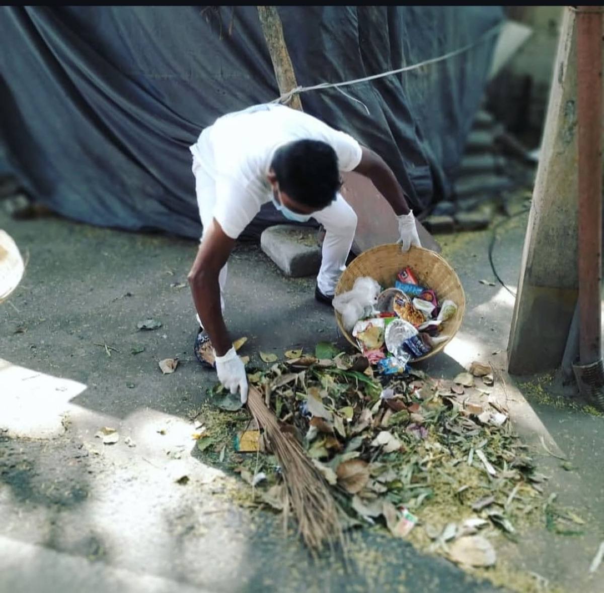 A community cleanliness drive, clearing litter from shared spaces.